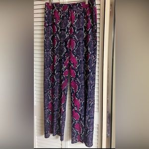 Snake print flare pants by Jude Connaly